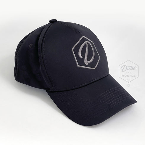 Black 5 Panel Cap, Grey thread, Embroidered D Logo, Three-Quarter Angle View